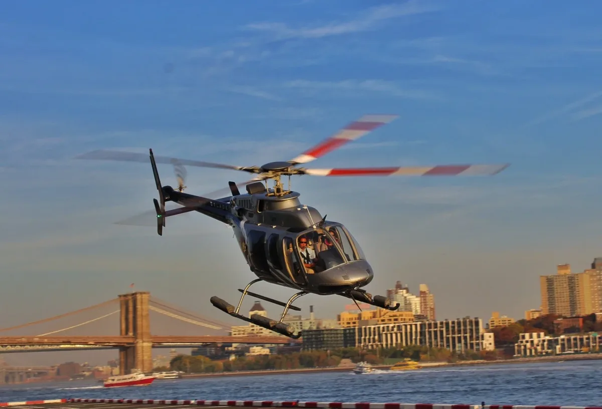 Helicopter flying near the Brooklyn Bridge and Manhattan waterfront
